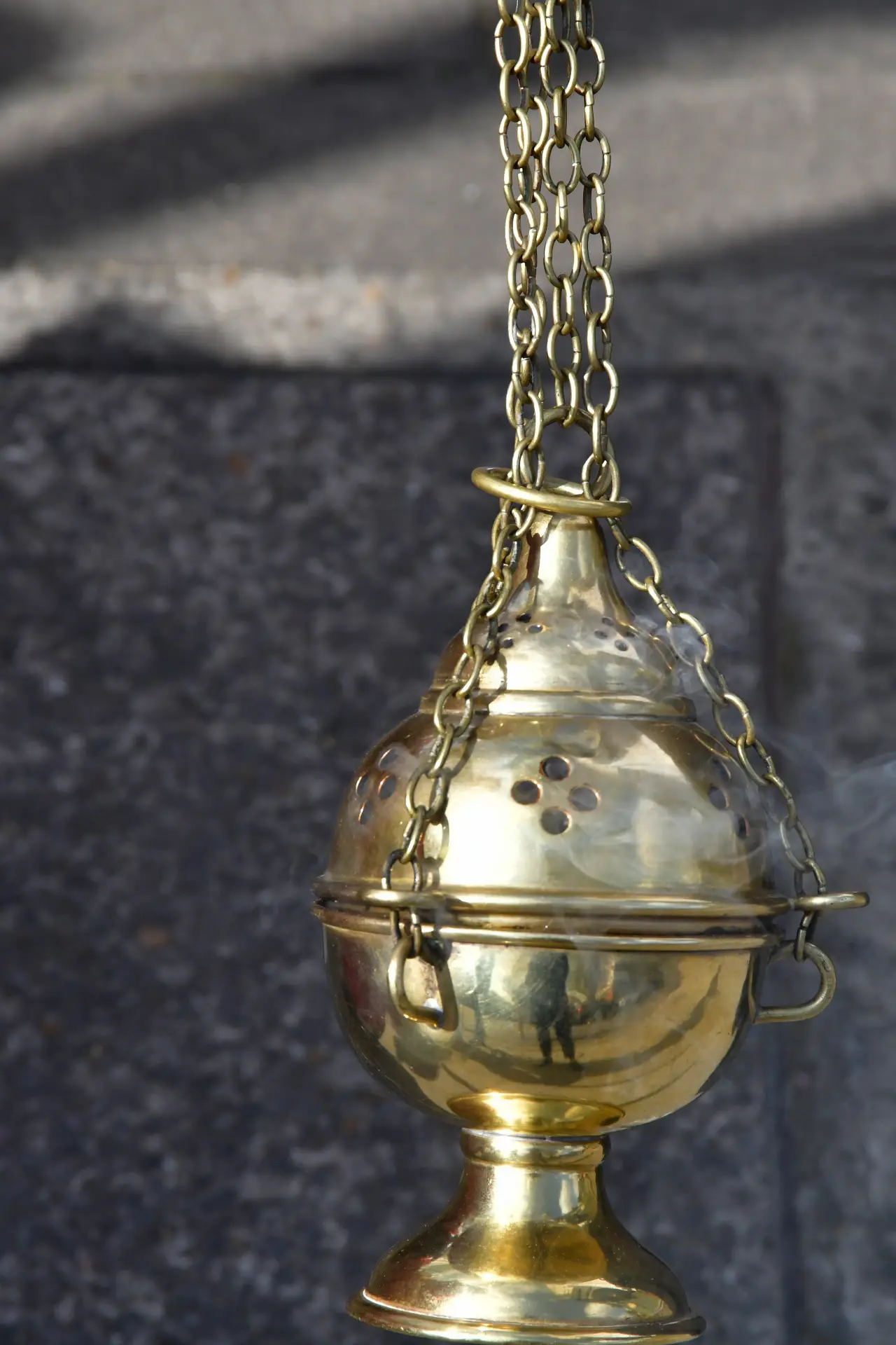 Incense rising from the thurible at the Sung Mass