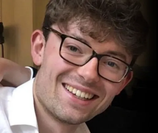 Harry Guthrie, outgoing Director of Music, smiling in a close-up photo